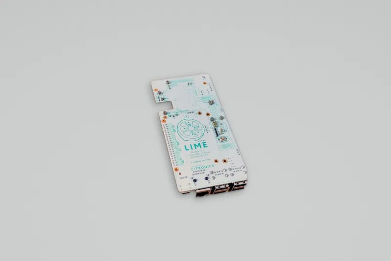 The Limeboard carrier board on a grey seamless, its connectors along the bottom edge and the CiSoM bay empty